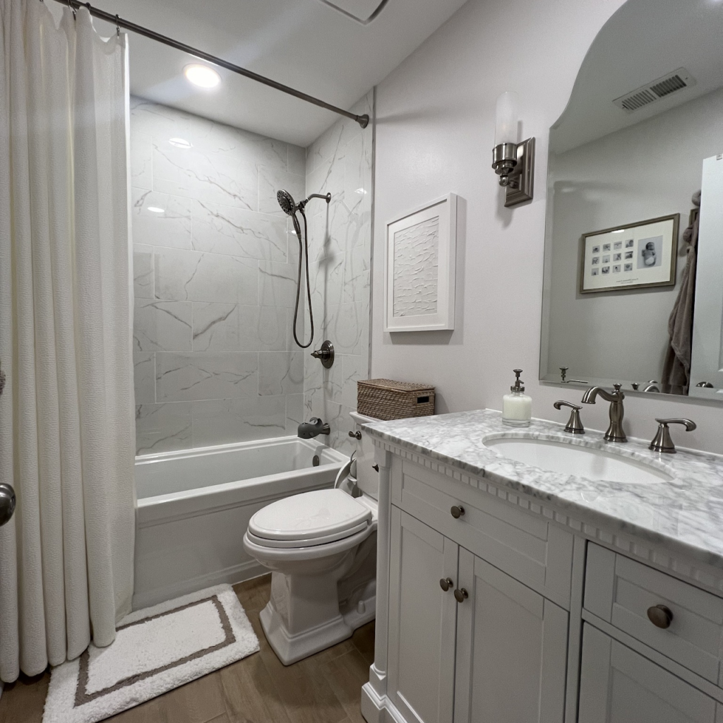 Bathroom floor and wall tile installation for a full bathroom remodel by Sparkk Construction