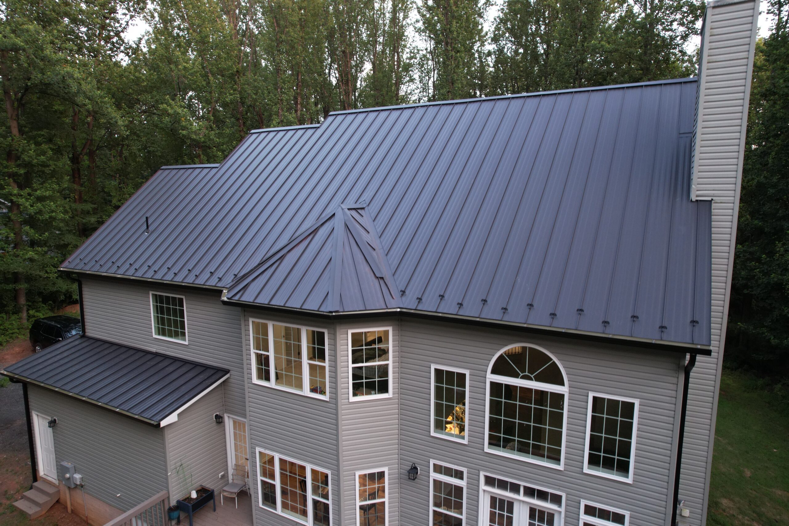 Custom standing seam metal roof installed by Sparkk Construction