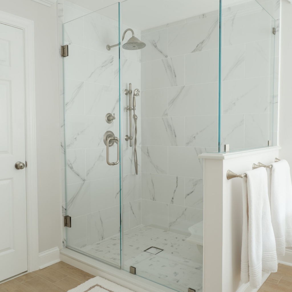 Complete bathroom renovation with tub replacement, new tile, vanity, and fixtures by Sparkk Construction