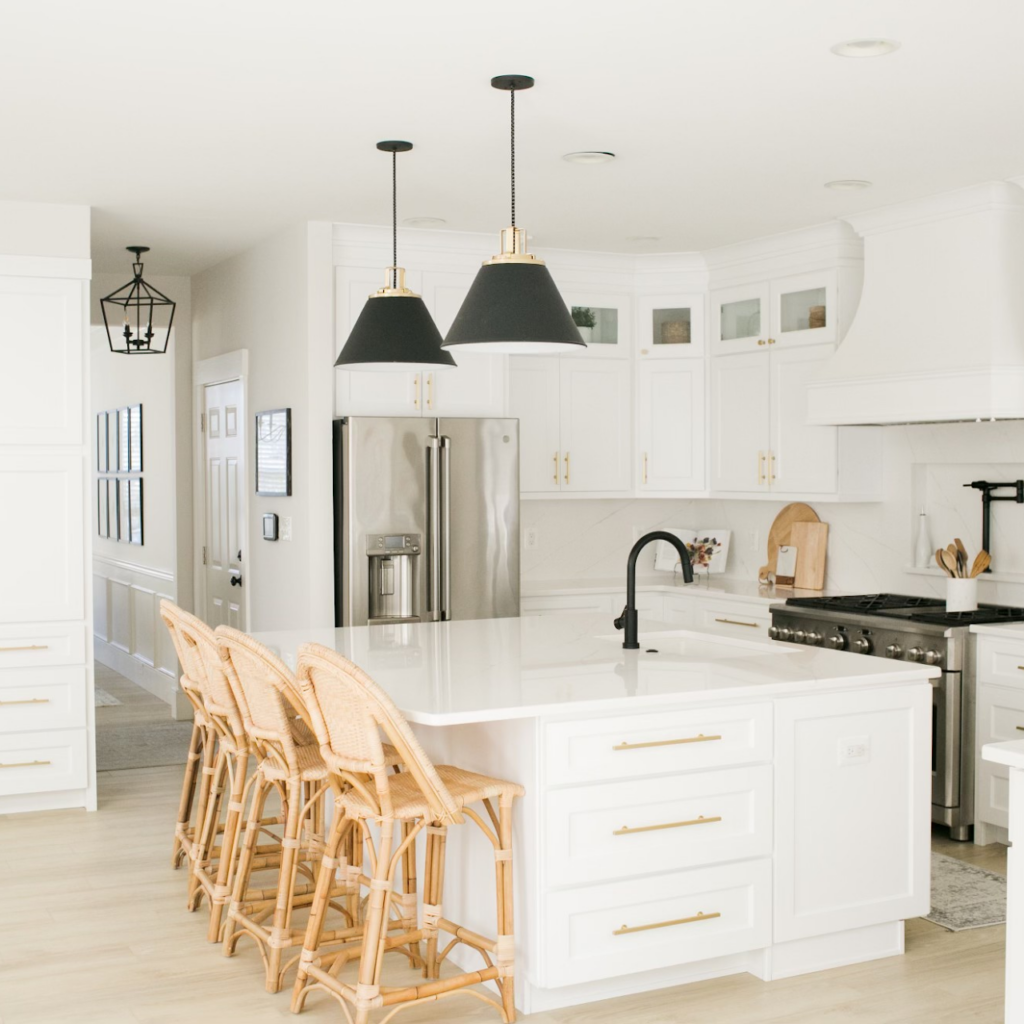 Modern white kitchen remodel with shaker cabinets and quartz countertops installed by Sparkk Construction