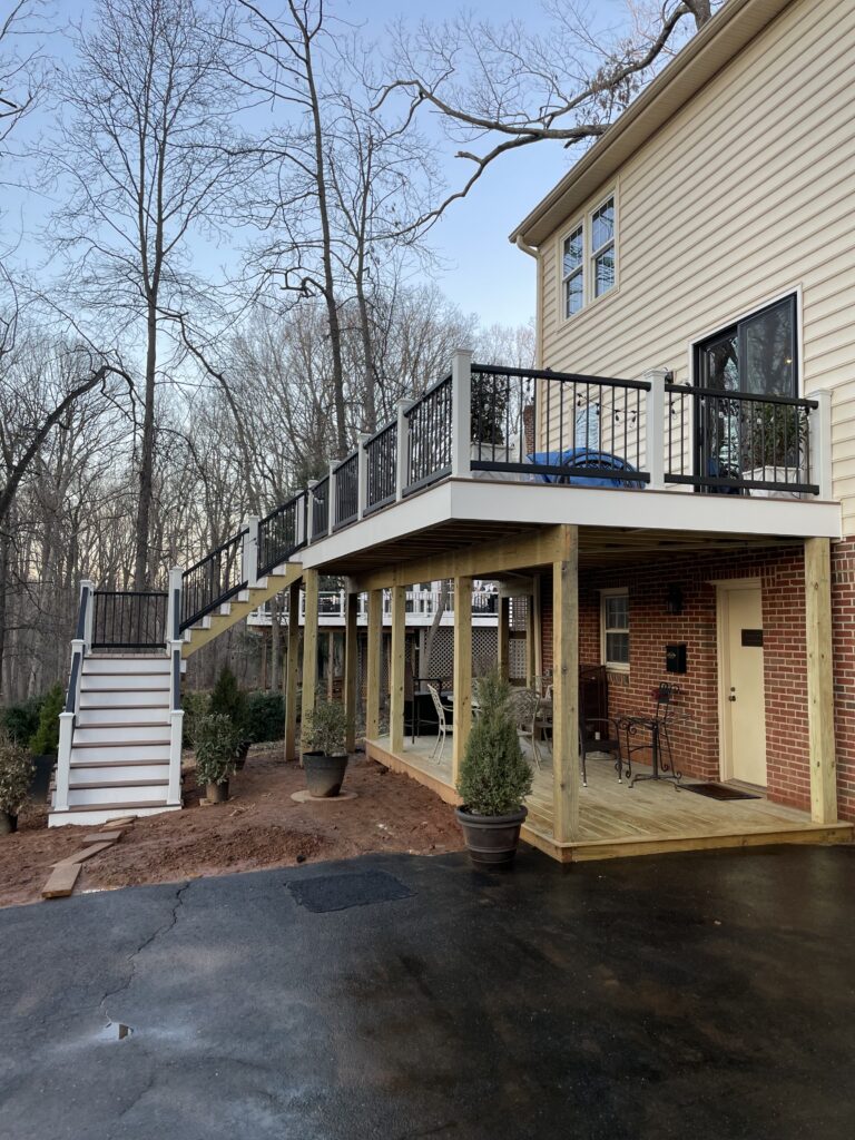 Professional deck builder installing composite deck boards