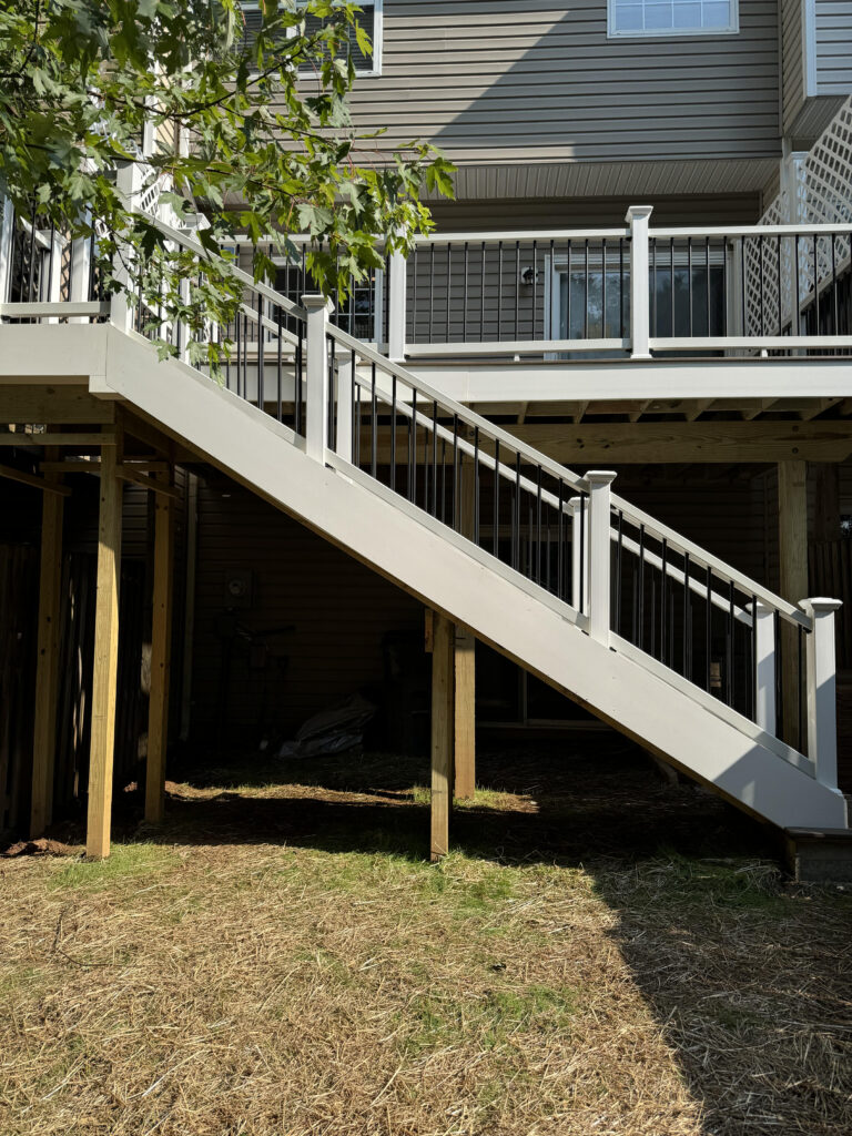 Custom deck builder in Northern Virginia installing a residential backyard deck by Sparkk Construction