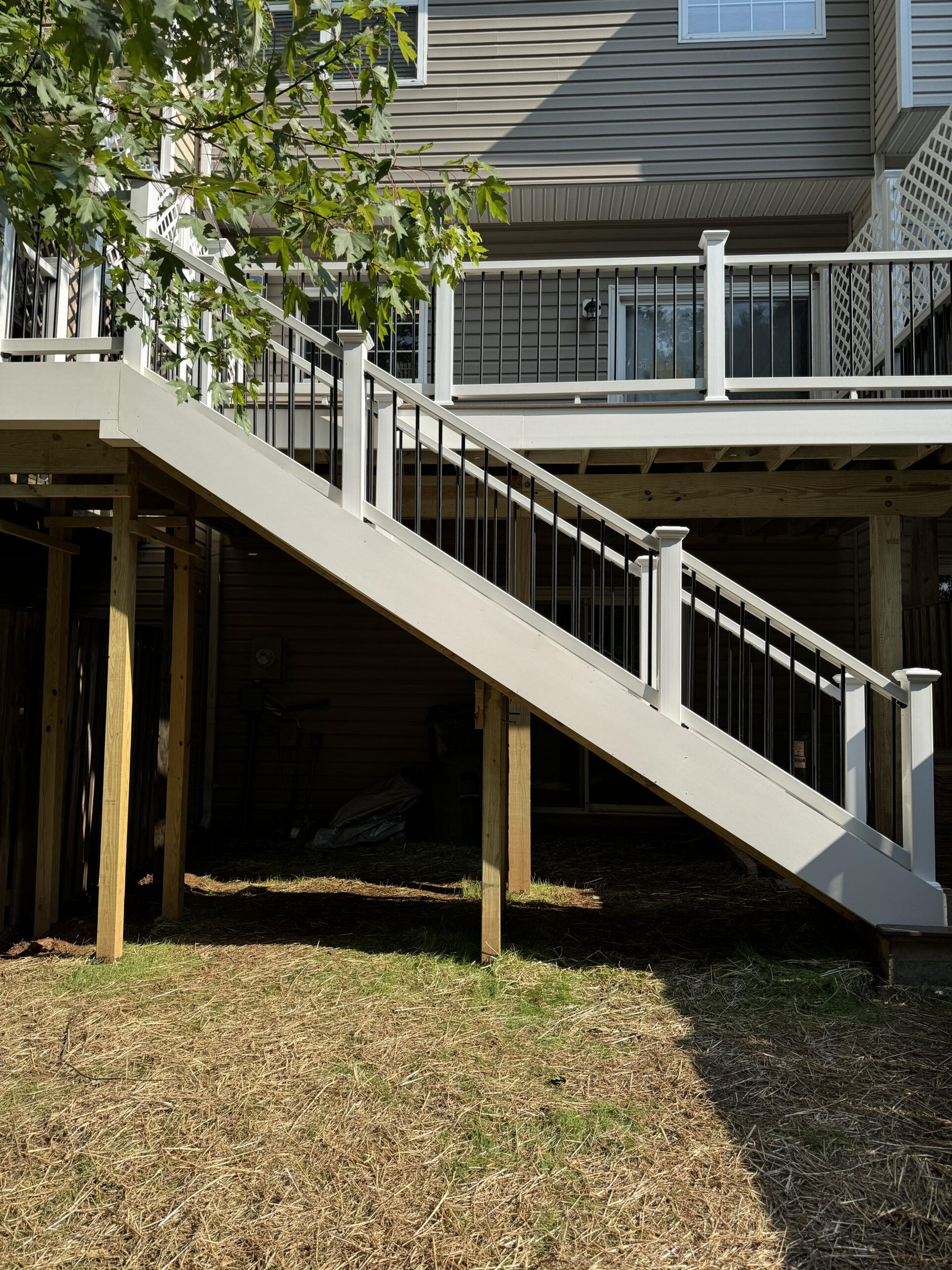 Custom deck builder in Northern Virginia installing a residential backyard deck by Sparkk Construction